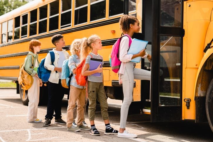 Children boarding a school bus