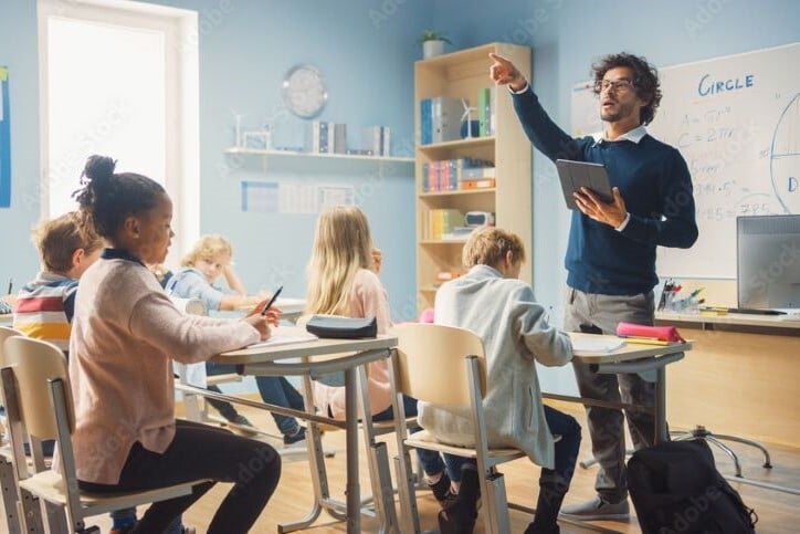Teacher in a classroom of students